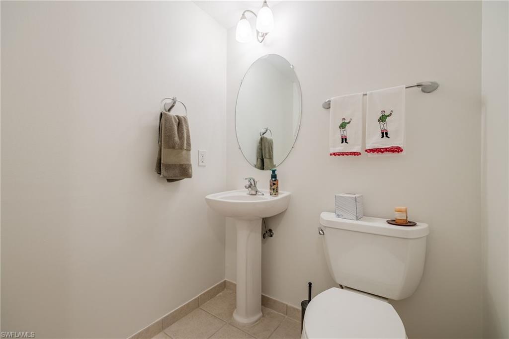 Bathroom with tile patterned floors and toilet