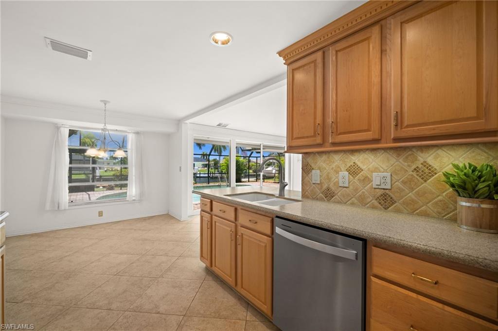 View of the pool and Gulf Access Canal from the kitchen