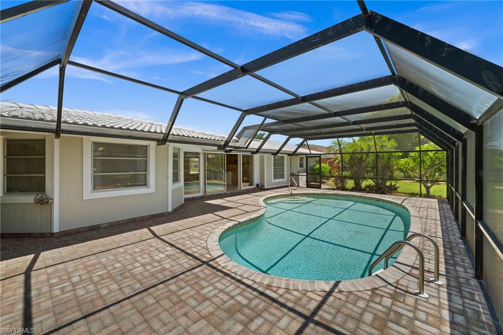 Screen enclosure surrounds the pool