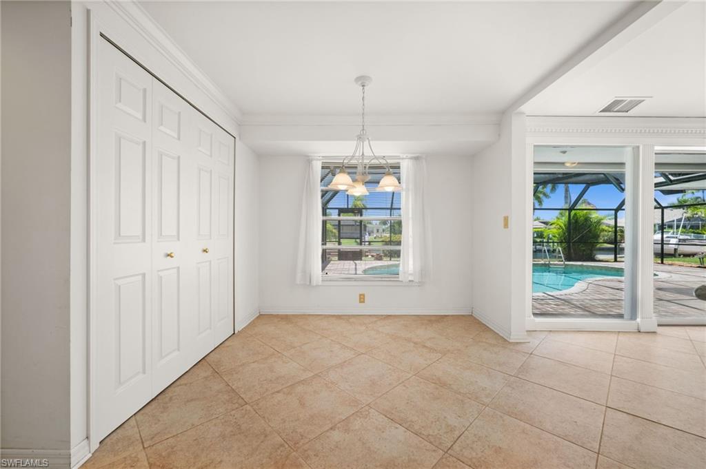 Dining room next to the kitchen, overlooking the pool