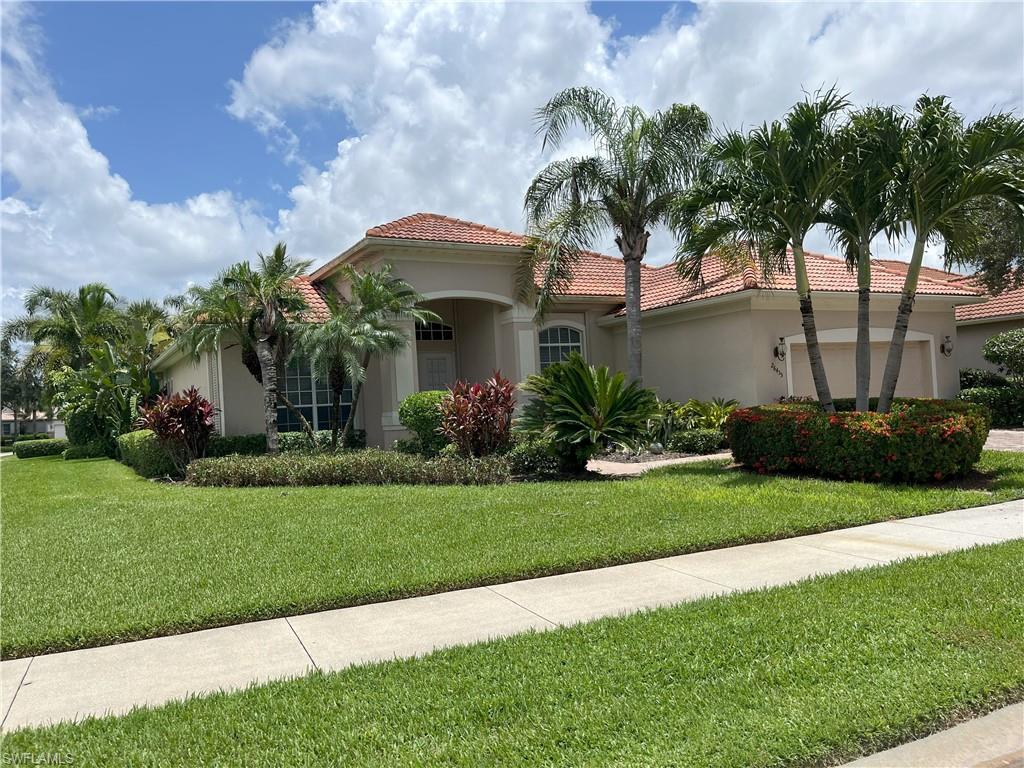Exterior residence with a stucco finish and a terracotta tile roof