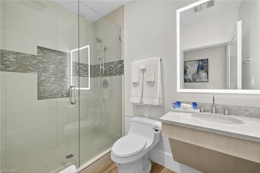 Guest suite Bathroom with vanity and a shower stall