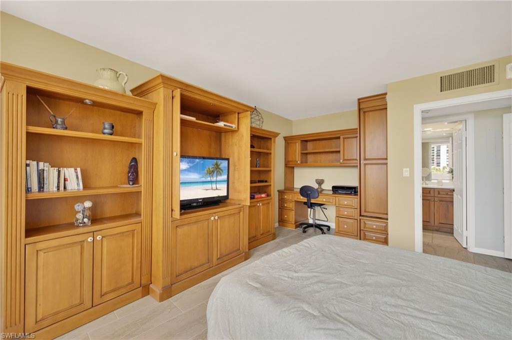 Bedroom with built in desk