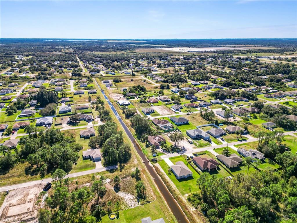 Expansive aerial capturing a developed residential area with numerous single-story homes
