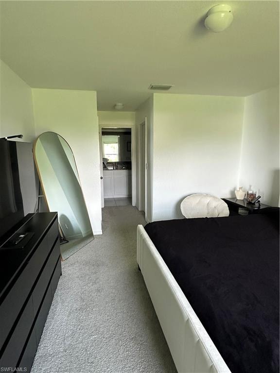 White walls and light gray carpeting create a bright interior
