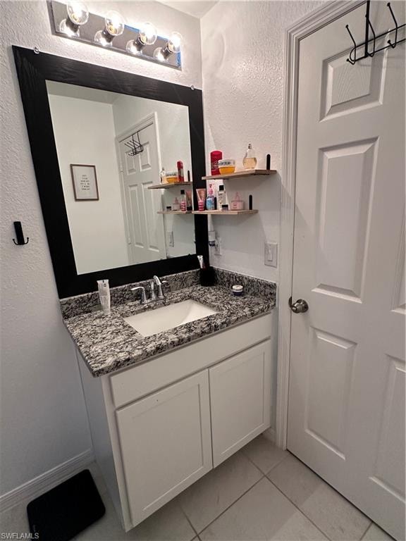 Vanity featuring a granite-finish countertop with an integrated sink and chrome faucet