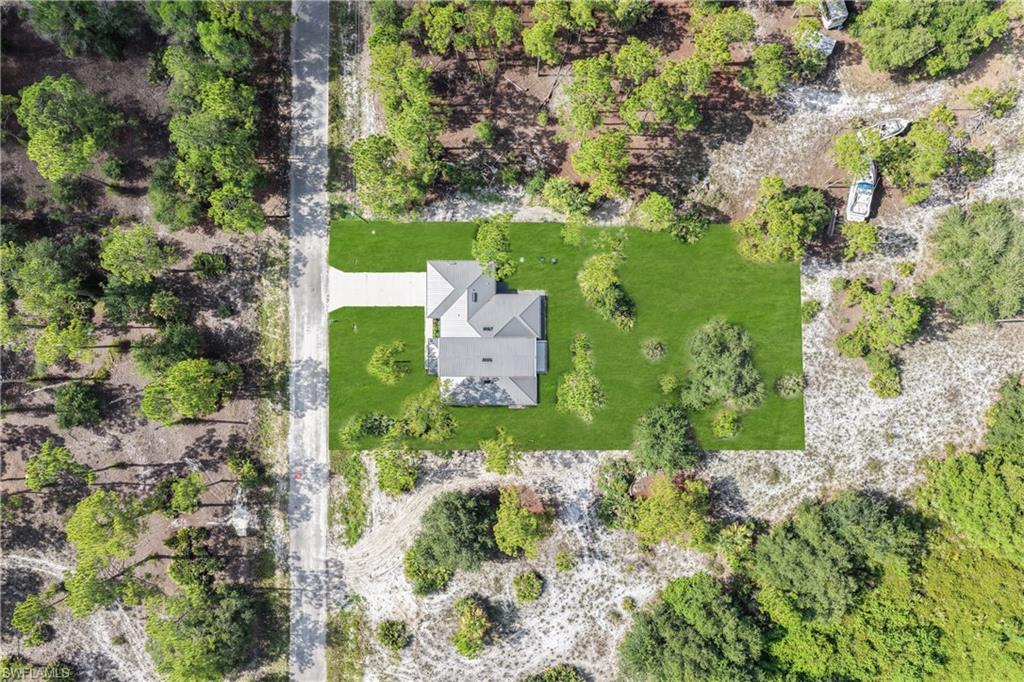 Contemporary single-story residence featuring a light gray shingle roof and a symmetrical architectural design