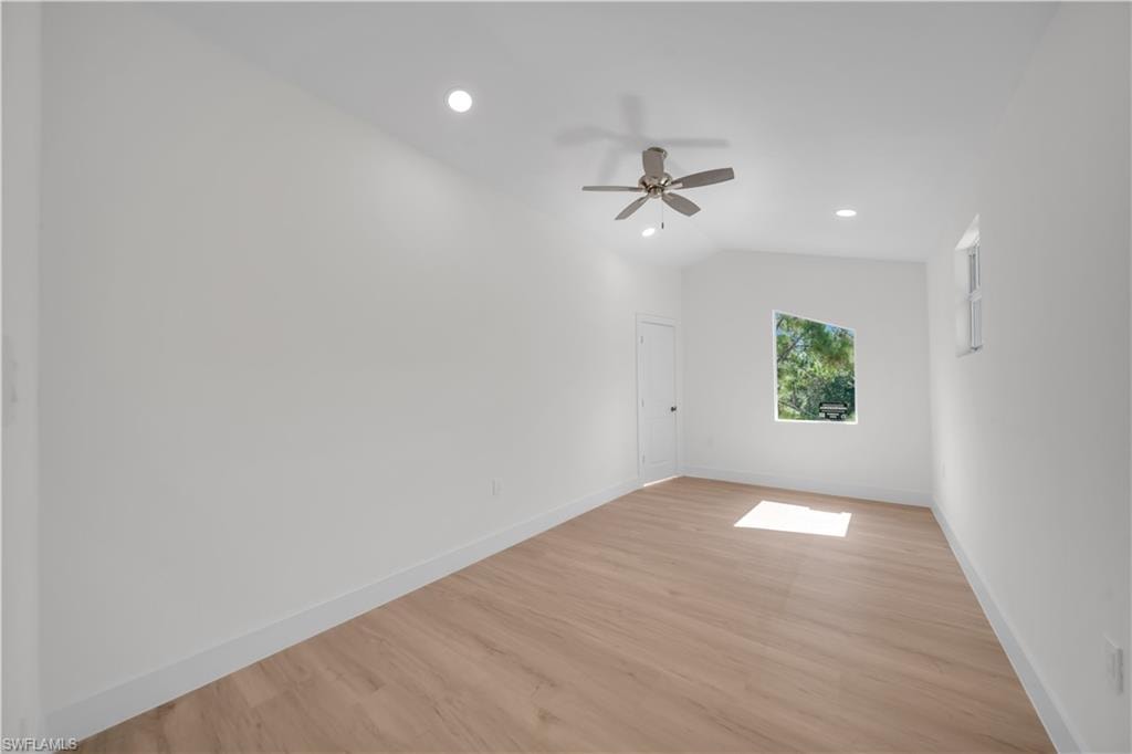 second floor studio/office  featuring light wood-finish flooring, recessed lighting, and a ceiling fan