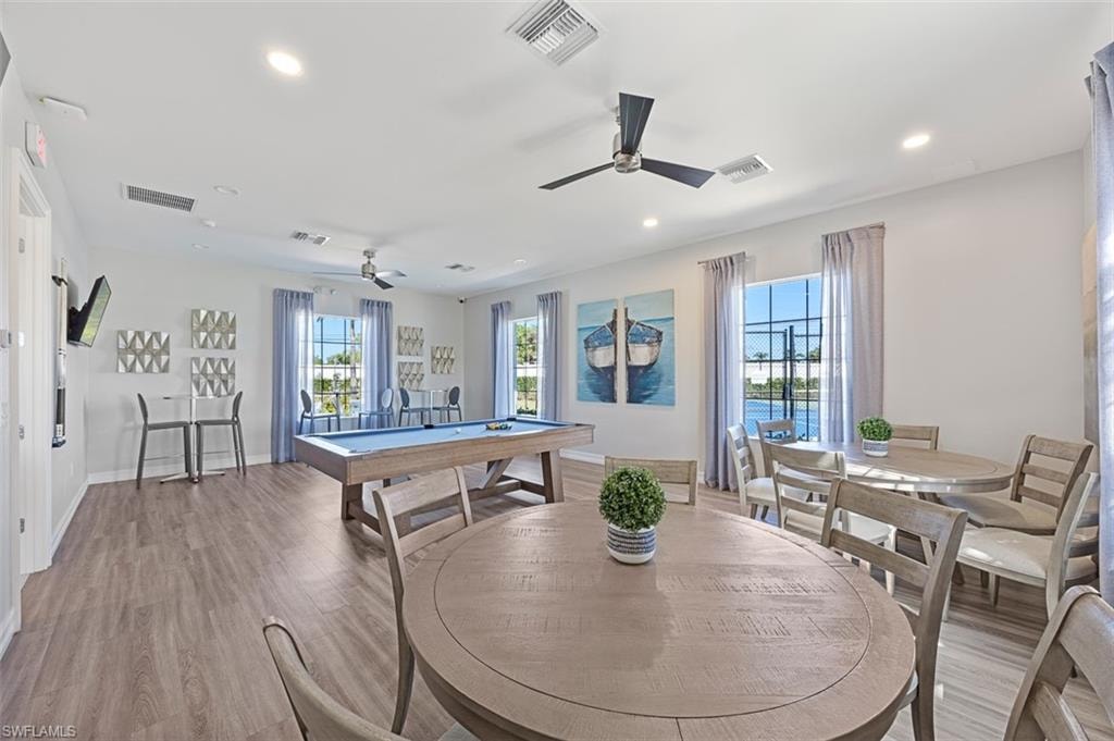 Game room with billiards table, wood finished floors, recessed lighting, and ceiling fan