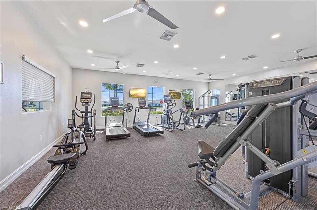 Gym with recessed lighting, carpet, and a ceiling fan