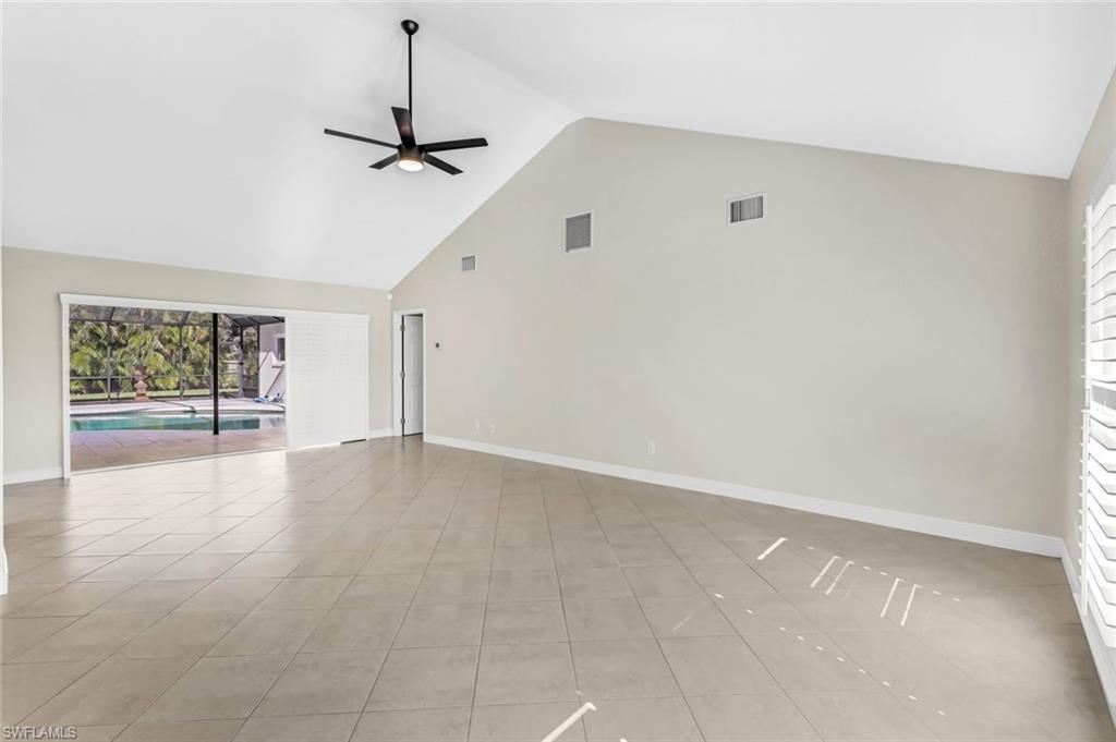 Living Room with Pocketing Sliders overlooking the Pool and Lanai