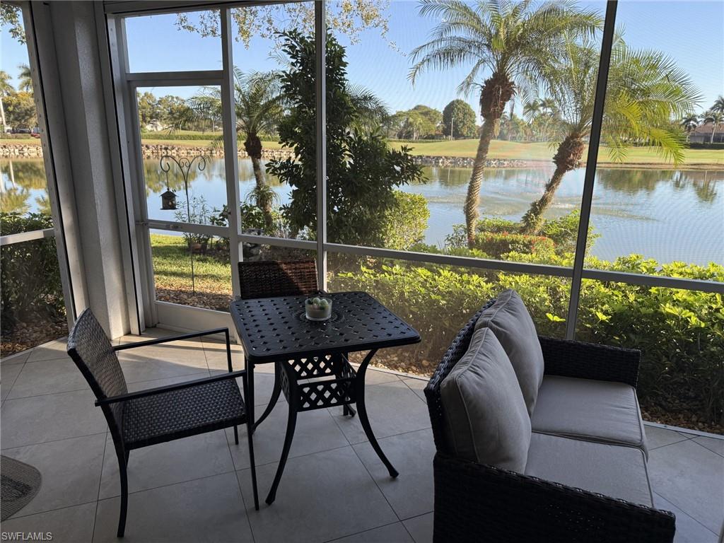 Sunroom / solarium with plenty of natural light and a water view