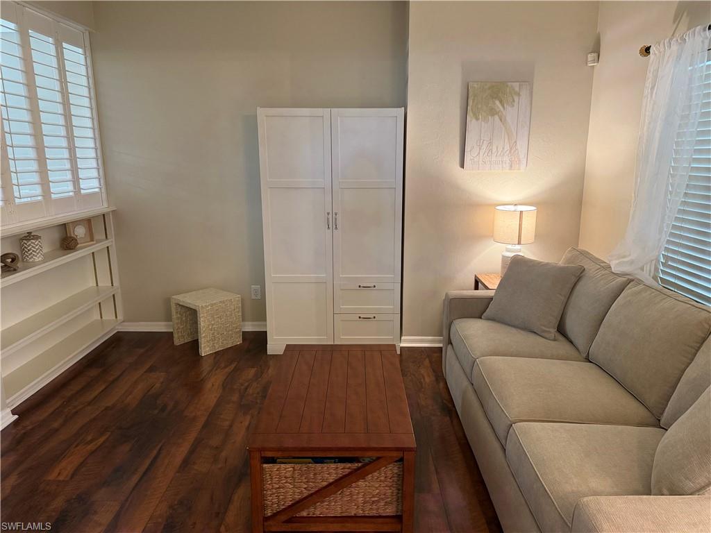 Living room featuring dark wood finished floors