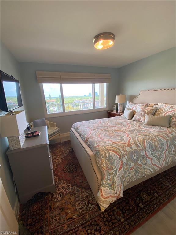 Bedroom featuring dark hardwood / wood-style floors