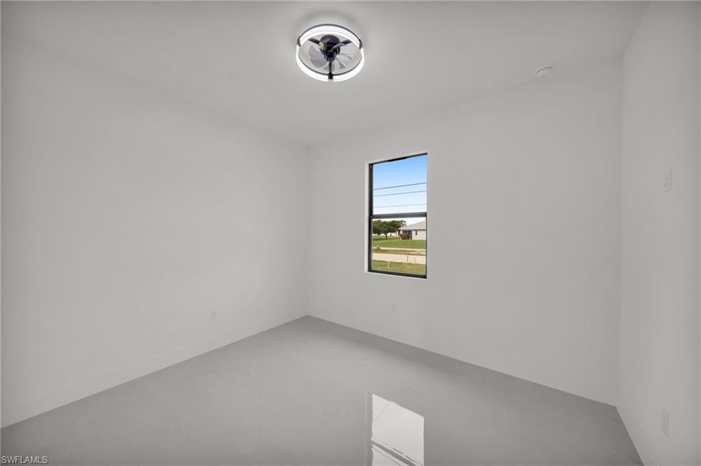 Bright interior space featuring a window with a black frame