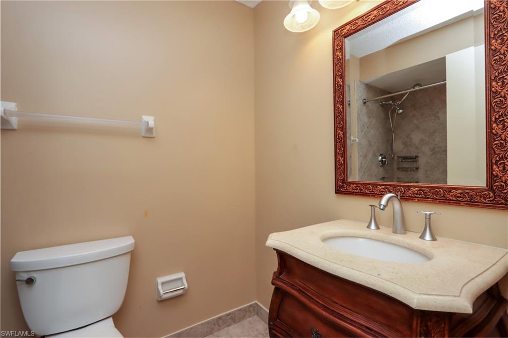 Bathroom with vanity and a shower