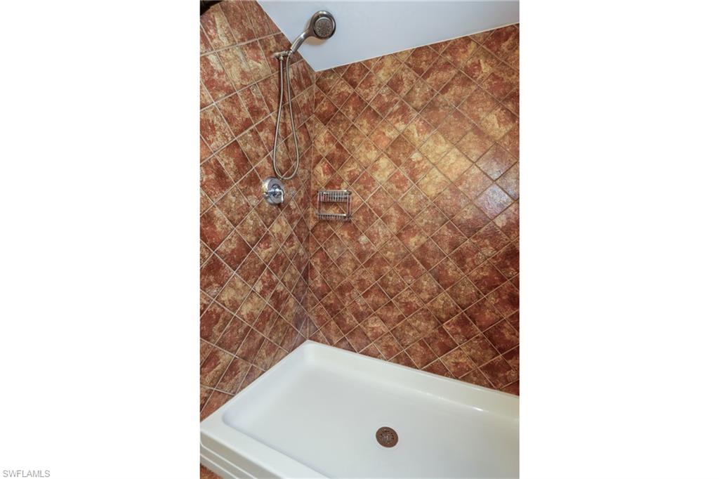 Bathroom featuring tiled shower