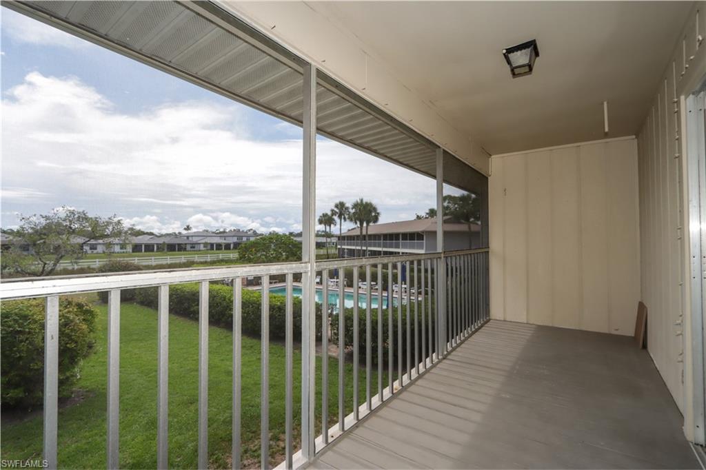 Balcony with view of pool area
