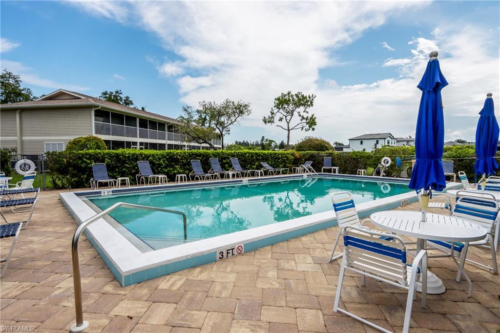 Community pool featuring a patio