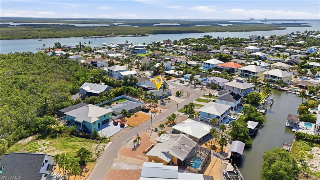 Aerial view of a coastal neighborhood with canal access