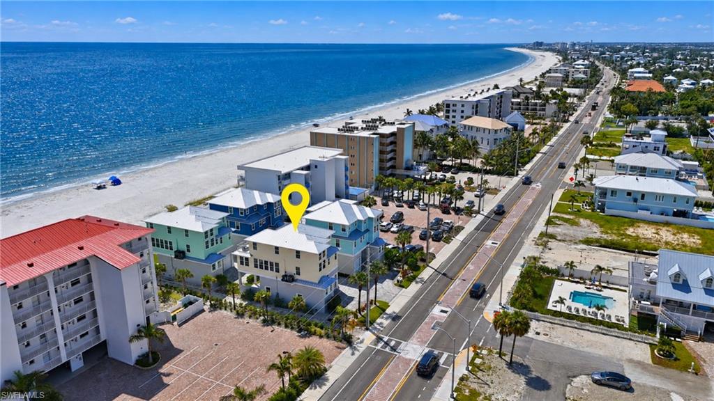 Coastal property situated directly across from a sandy beach and expansive ocean - Virtually Edited Image