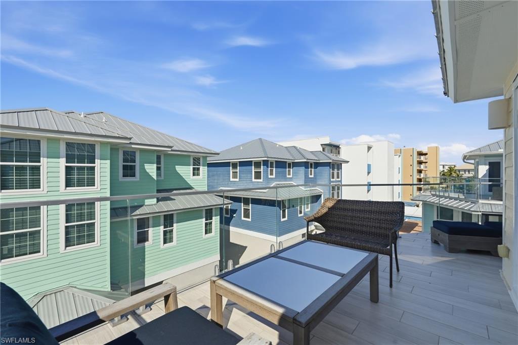 Balcony with glass railing, providing an open-air extension - Virtually Edited Image