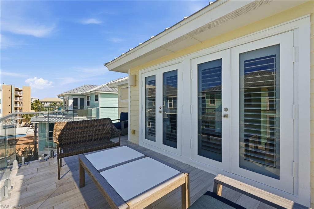 Balcony with glass railing, providing an open-air extension - Virtually Edited Image