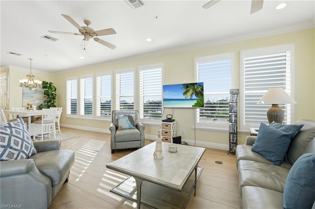 Recessed lighting, wood-finish flooring, and multiple ceiling fans - Virtually Edited Image
