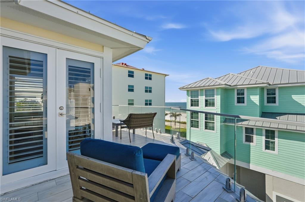 Balcony with glass railing, providing an open-air extension - Virtually Edited Image