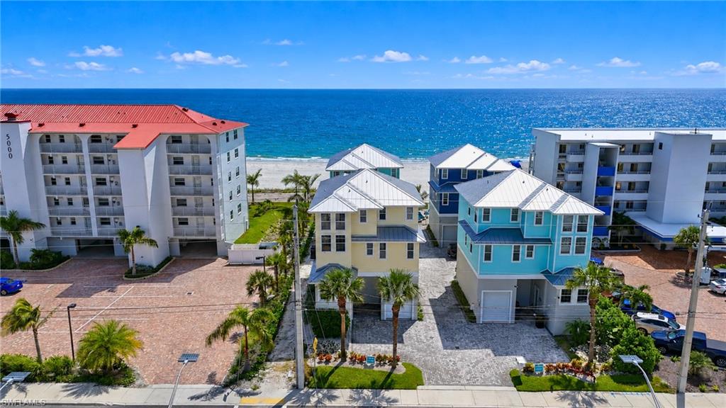 Coastal residences with direct beach access, elevated construction, and multi-story designs - Virtually Edited Image