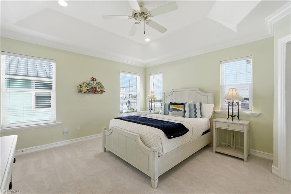 Tray ceiling with recessed lighting and crown molding - Virtually Edited Image