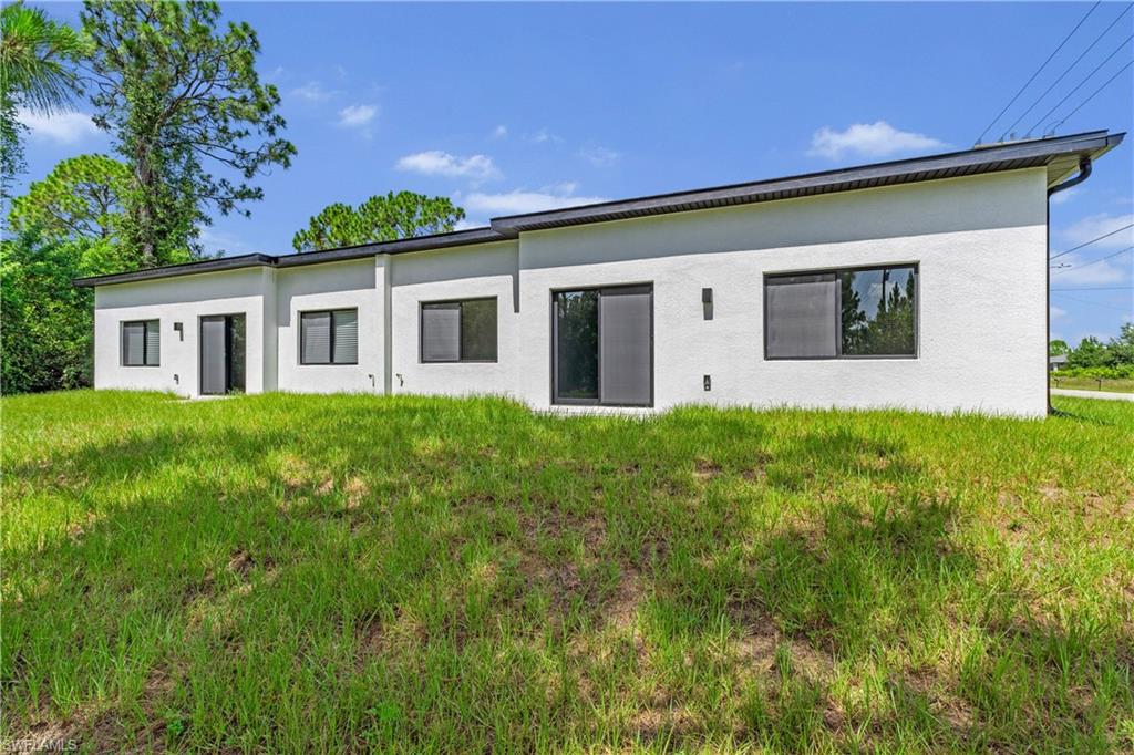 Contemporary exterior with white stucco finish