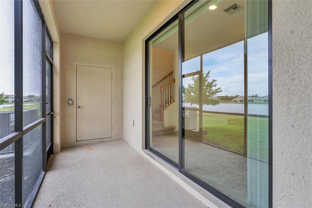 Unfurnished sunroom with a water view