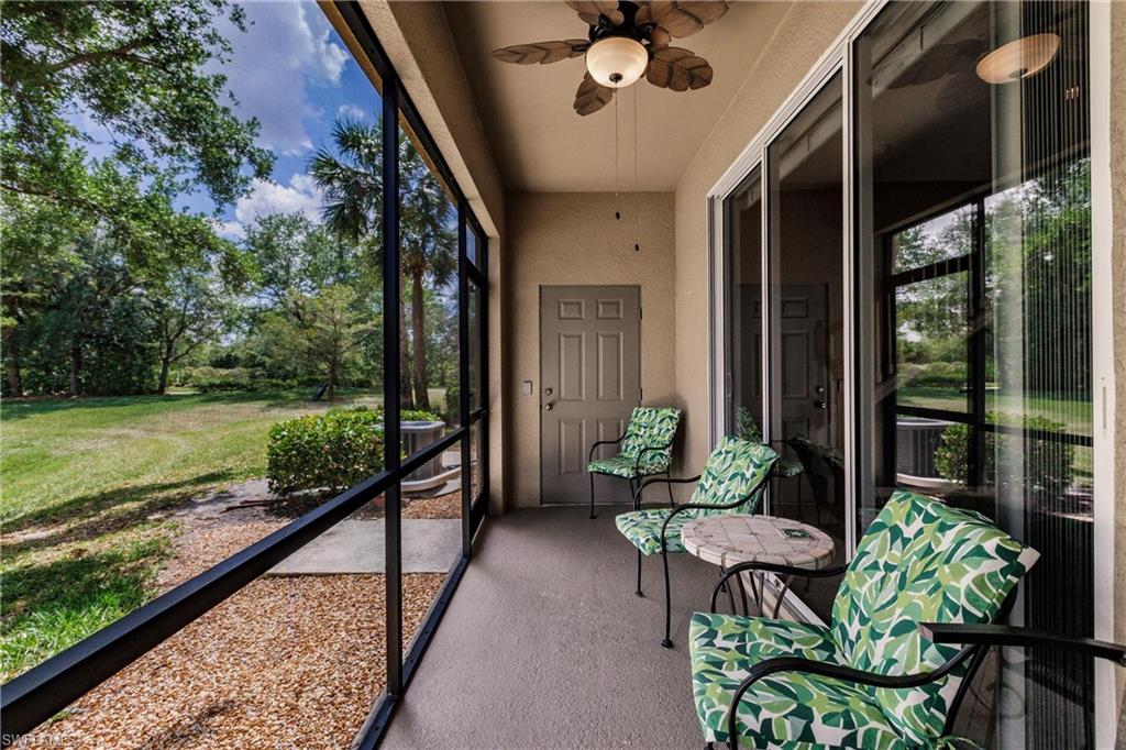 Sunroom / solarium with a ceiling fan