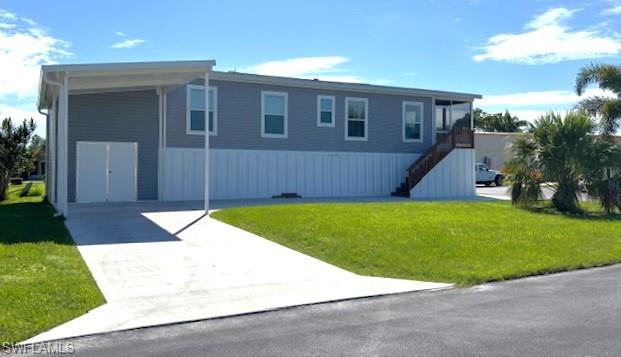 SW side of home featuring double doors to attached shed