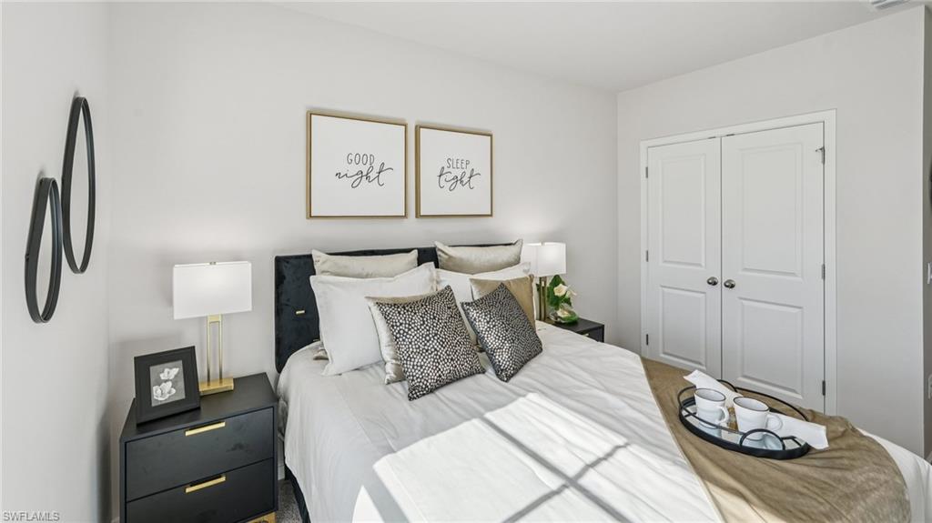 Inside of secondary bedroom with closet space.