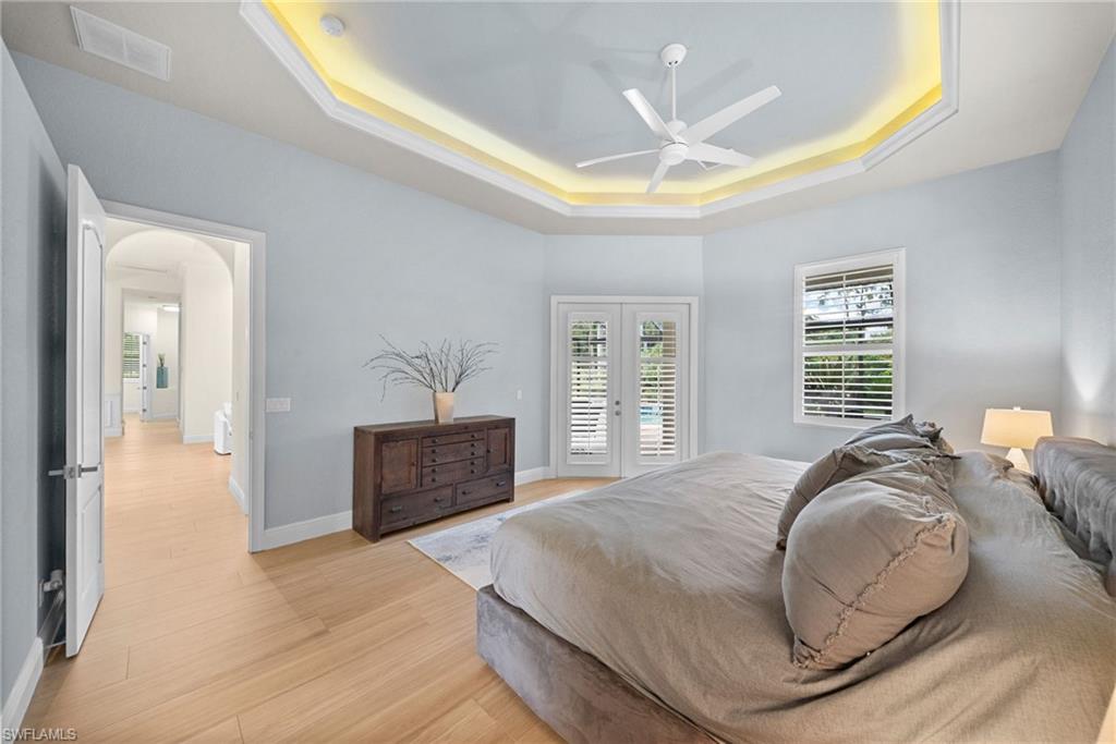 Tray ceiling with recessed lighting and a ceiling fan