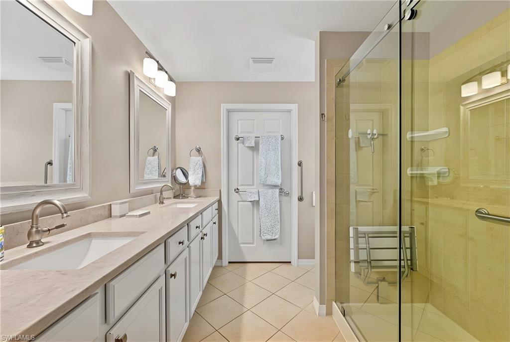 Master Bathroom with walk-in shower with a custom TOTO toilet .