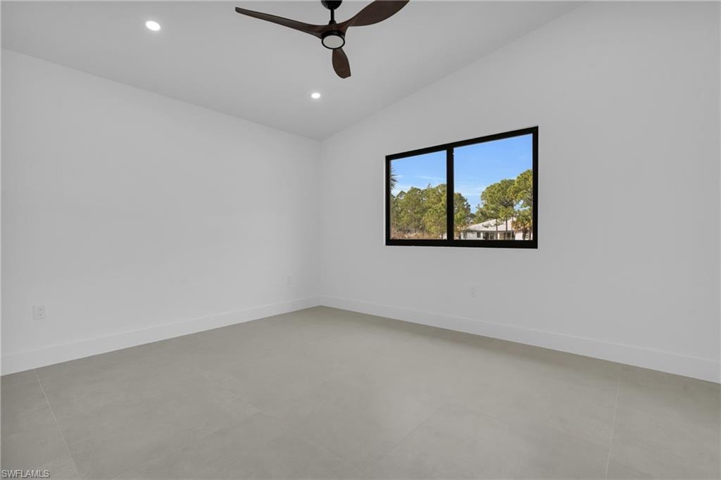 Unfurnished room with vaulted ceiling, recessed lighting, and ceiling fan