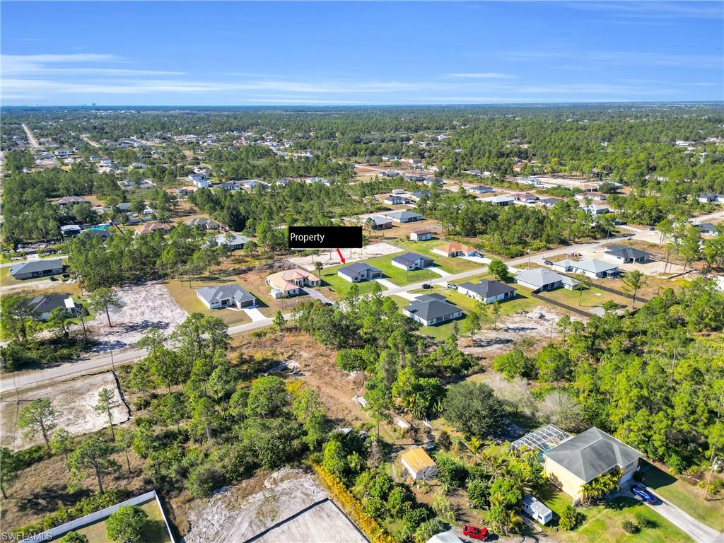 View of property location with nearby suburban area
