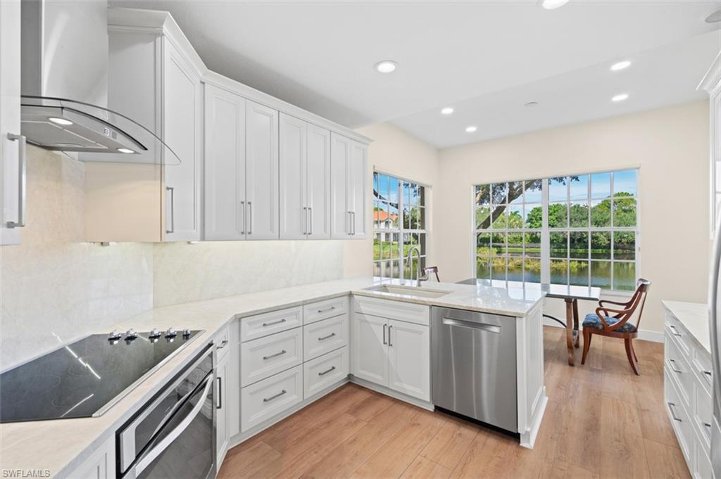Creamy white custom cabinetry along with high-end appliances.