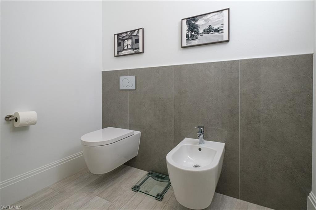 Masterbath with wall mounted toilet and bidet