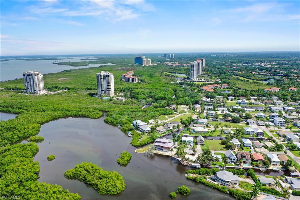 Aerial perspective showcasing a coastal community with waterfront properties