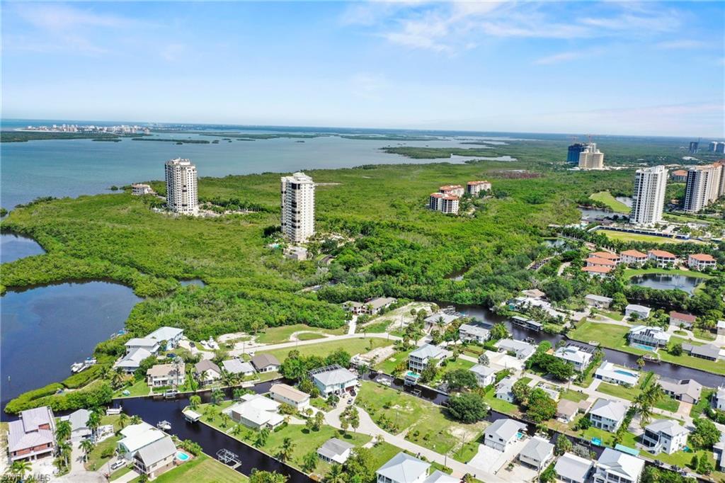 Aerial perspective showcasing waterfront properties with private boat docks