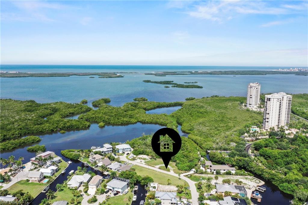 Aerial perspective showcasing a coastal landscape with expansive waterways and verdant land