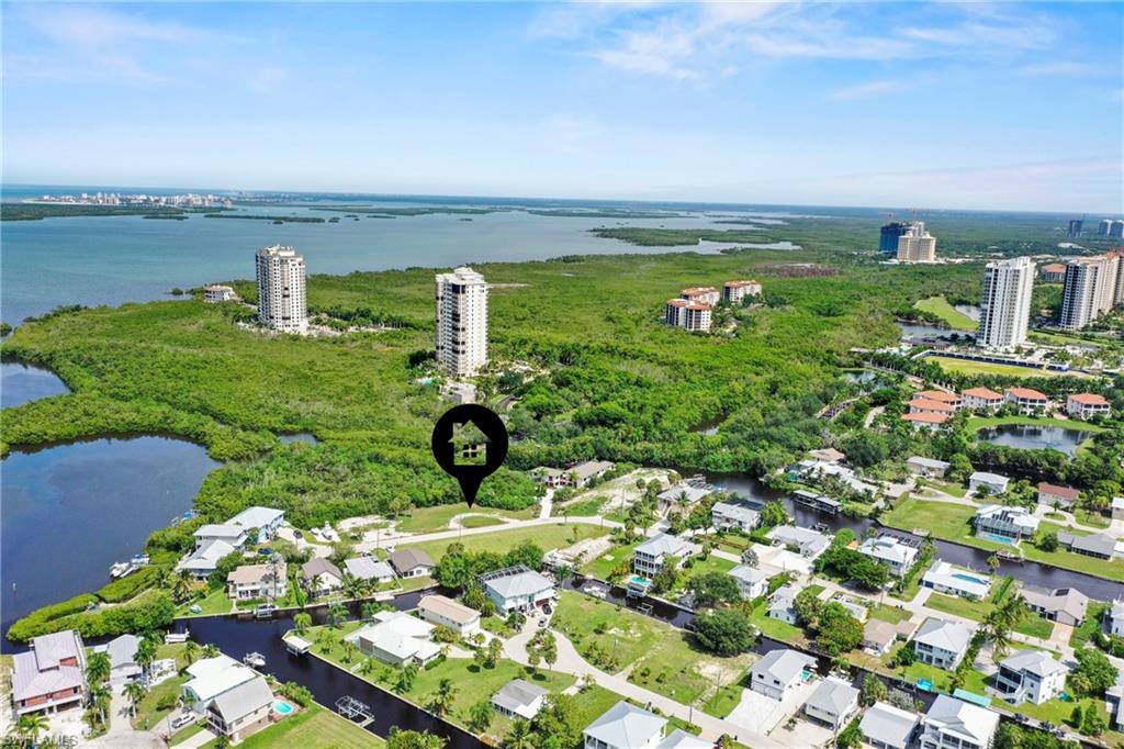 Aerial perspective showcasing a residential neighborhood with surrounding waterways