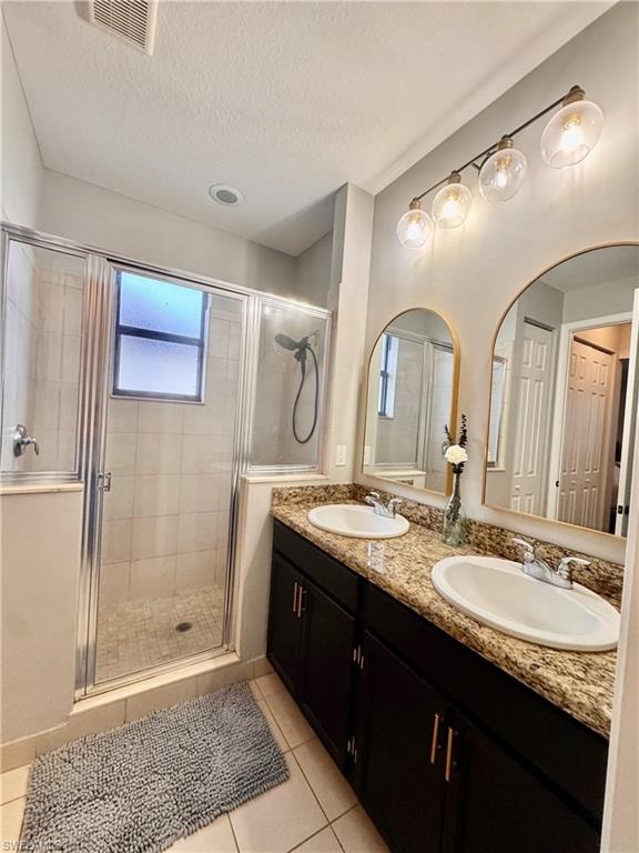 Dual vanity with granite-style countertop, undermount sinks, and dark cabinetry