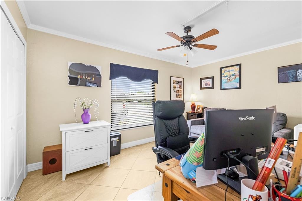 Room featuring neutral wall tones, crown molding, and tile flooring