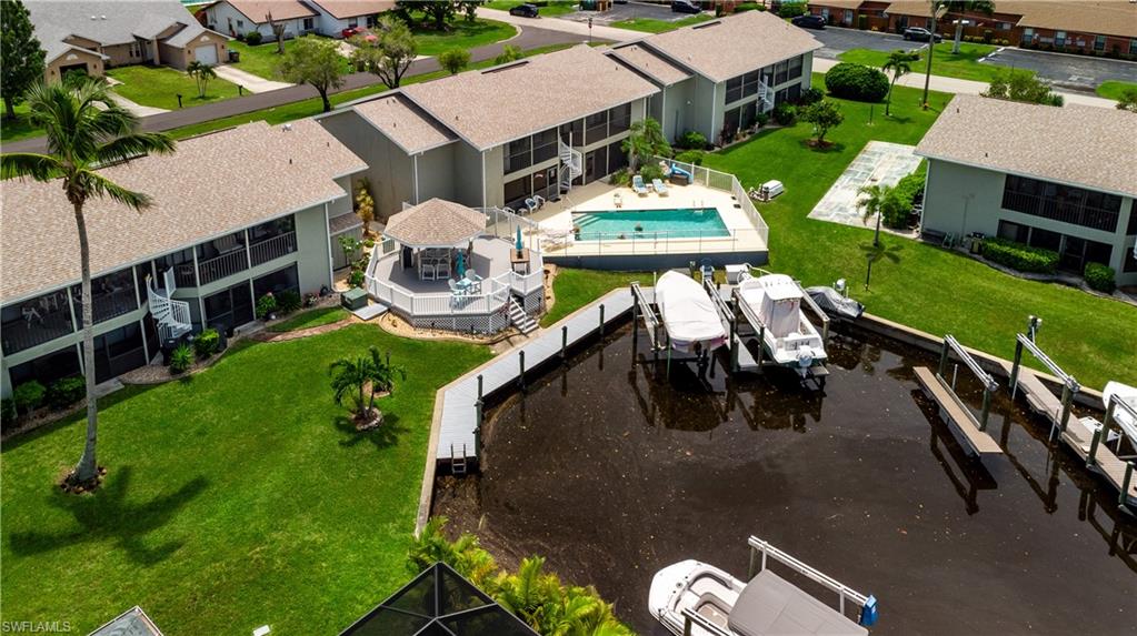 Waterfront property featuring multiple boat lifts and dock access