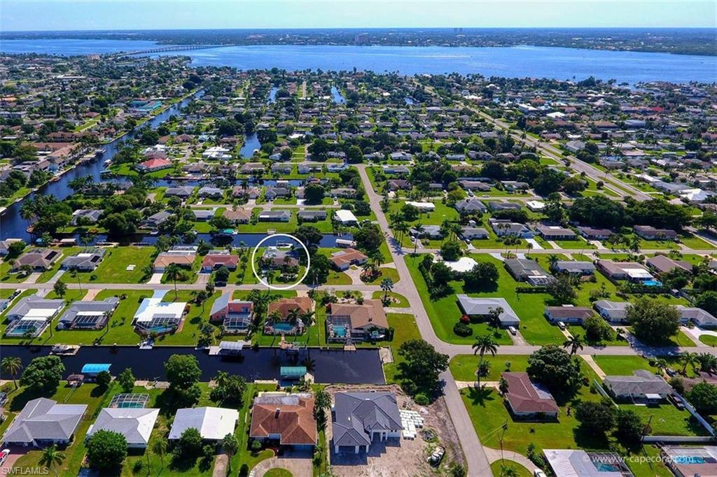 Waterfront neighborhood featuring canals and a large body of water